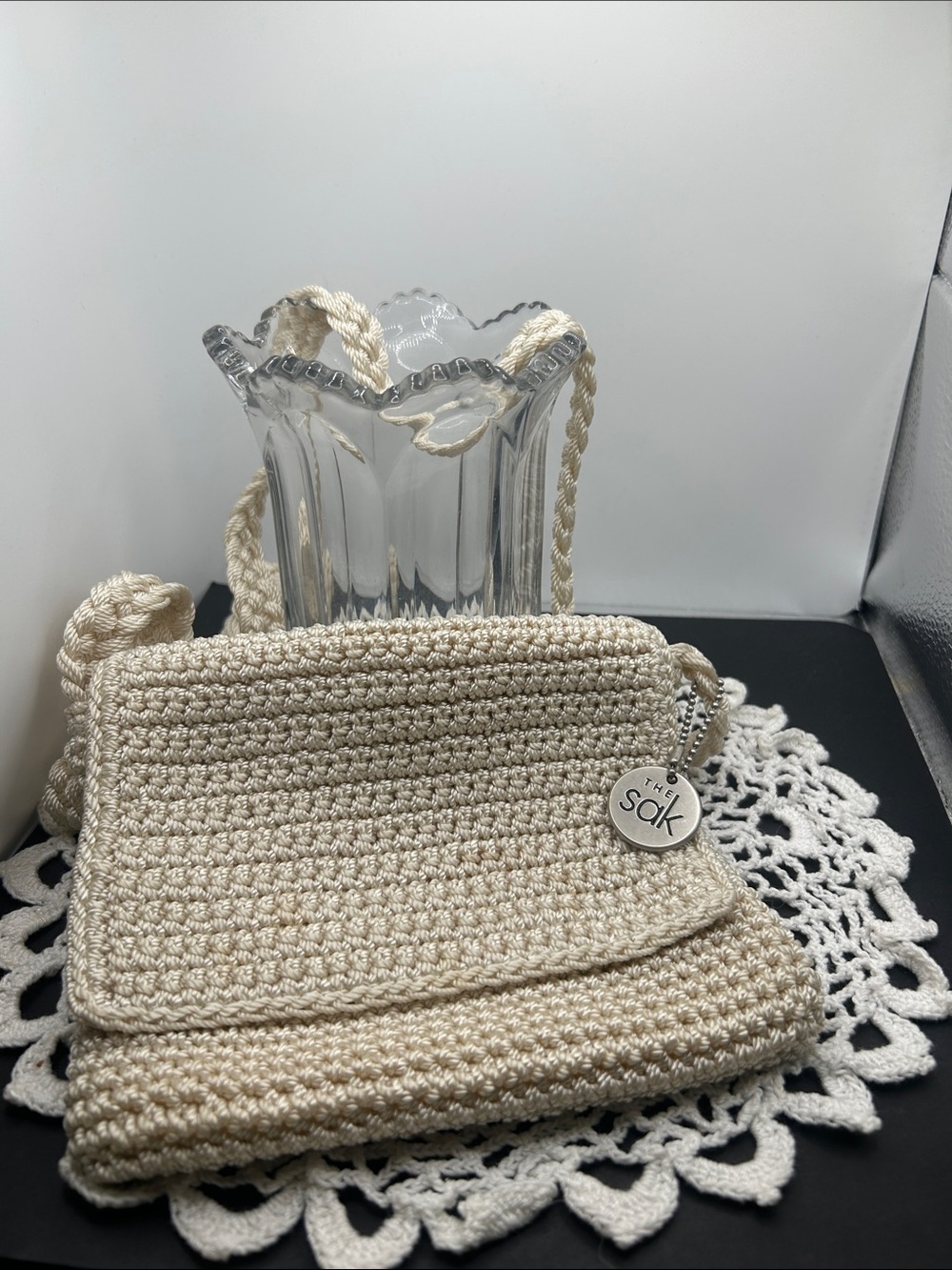 The Sak Cream Crochet Crossbody Shoulder Bag with Branded Charm